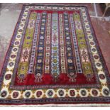 A Turkish Rug with five central bands and a geometric border, in a thick hand-knotted wool pile, 280