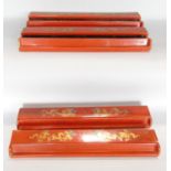 Four orange lacquered, with gold painted dragon mahjong tile holders, in need of some repair.