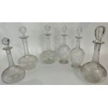 A pair of squat globe shaped decanters with Greek key engraving, a pair of vase shaped decanters,