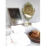 A miscellaneous collection of items including a brass oval vanity mirror, a chromium metal vanity