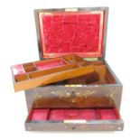 A 19th century rosewood travelling box richly decorated with brass and mother of pearl inlay, with a