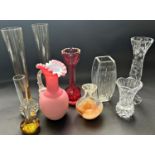 A mixed selection of glassware comprising a pink crimped jug, a bohemian red crenulated vase, pair