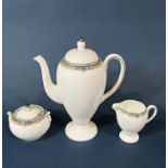 A collection of Wedgwood Amherst porcelain coffee cans and saucers with coffee pot, sugar basin