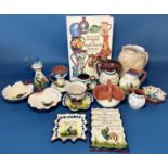 A collection of Torquay ware including hatpin stand, various jugs, small trinket dishes, etc,