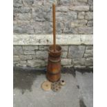 A vintage coopered and steel banded butter churn