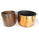 A large copper and brass rimmed cooking pot with brass handles , 34cm diam, and an Edwardian “