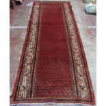 Persian Runner with repeated central boteh design, incomplete border due to a section of the rug