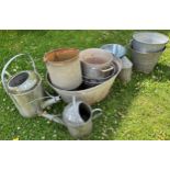 A small collection of vintage and later galvanised wares to include watering cans, buckets, oval