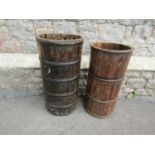 An eastern coopered and steel banded wooden cylindrical bucket/vessel, 35cm diameter x 69cm high,