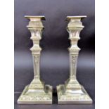 A pair of silver Neoclassical style square candlesticks, Sheffield 1908, maker Hawksworth, Eyre & Co