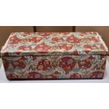 An upholstered box ottoman of rectangular form with hinged lid, 107 cm long x 48 cm wide x 37 cm