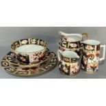 A Royal Crown Derby lidded bowl and cover with loop handles, further open bowl and a shaped dish,