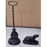 A cast iron door porter with loop handle stamped to back AK & Sons, 489, 39 cm high together with