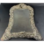 A silver framed dressing table mirror (af) 42cm x 34cm