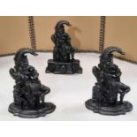 A matched pair of Mr Punch cast iron door porters with stepped shaped bases, 32 cm high, together