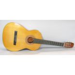 A BM Espana six string acoustic guitar made in Spain with plastic carry case