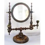 A 19th century vanity mirror with a circular central mirror (original plate) held on a bobbin turned