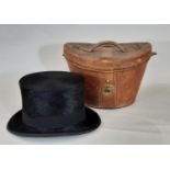 Vintage black silk top hat by Christys' in leather hat box lined with red velvet. Internal