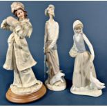 A Lladro figure of Don Quixote, three further Nao figures and a resin figure of a girl in winter