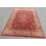 A Persian style machine-made rug, with a continuous floral pattern 170 x 240 cm
