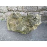 An antique weathered carved natural stone gargoyle approx 60 cm long x 35 cm wide