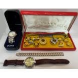 Five gentlemen's wristwatches to include a Stauer Graves Automatic Chronograph example with day,