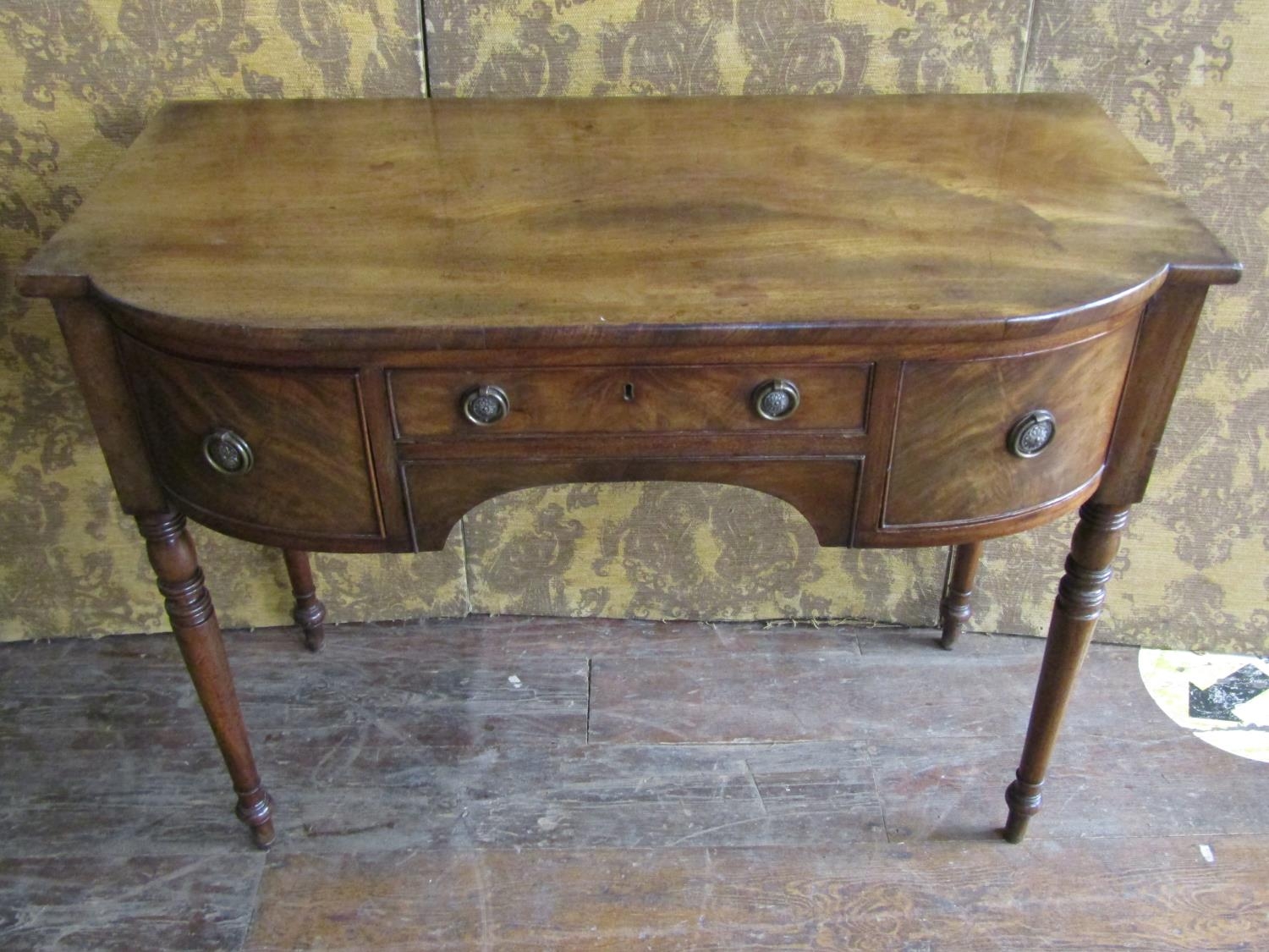 A small George III mahogany semi bow-front sideboard, with central long drawer flanked by a