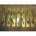 A set of seven good quality large heavy gauge vintage brass door handles with solid back plates,