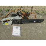 A Titan 2000w electric chain saw, with original packaging, hand book, etc, little used