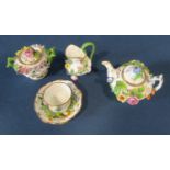 A miniature German porcelain (probably Meissen) tea service comprising teapot, sucrier and cover,