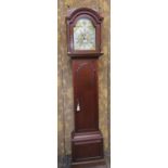 A Georgian mahogany London longcase clock with arched door the hood with column supports enclosing a