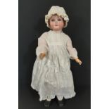 German bisque head doll circa 1910 by Schoenau & Hofmeister with sleeping blue eyes, open mouth with