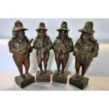 Four continental carved wooden 'Wandering Minstrels' each 32cm tall approx (one with glued legs)