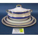 A quantity of Wedgwood dinner ware with a repeating blue and gilt banded colourway comprising meat