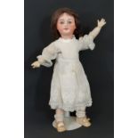 Early 20th century SFBJ bisque head girl doll with jointed composition body, blue sleeping eyes,