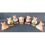 A collection of six Nat West Bank piggy banks by Wade and a further elephant