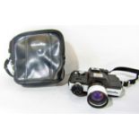 A Minolta 110 zoom SLR camera with Rokkor Macro 1:4,5 F25-50 lens and original Minolta carry case