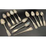 Ten Scandinavian silver metal teaspoons with shell crest, and one slightly bigger spoon to match,