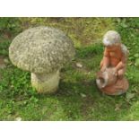 A small weathered cast composition stone toadstool with domed cap, 35cm high together with a small