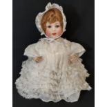Early 20th century 'Jutta' bisque head character baby doll circa 1914 by Cuno & Otto with brown