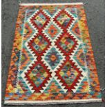 A Chobi Kilim with two diamonds flanked by stepped medallion, 124 x 82cm approx.