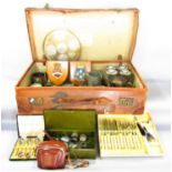 A selection of items contained in a vintage leather suitcase, tankards, goblets, utility cutlery,