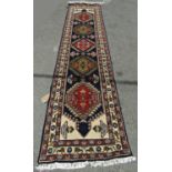 A North West Persian Heriz Runner, with five diamond medallions, hand-knotted in wool on cotton,