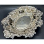 A late Victorian silver fruit bowl with pierced sides and embossed with fruit, Sheffield 1897, maker