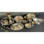 A selection of silver plate including a pair of wine coasters, a small pieced plate, an oval dish