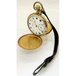 A gold plated gentleman's full hunter pocket watch with white enamel dial