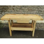 A Whitegate contemporary beechwood workbench fitted with two vices and a gallery drawer, etc, in