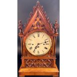 A good quality Victorian bracket clock, the casework to both clock and bracket with gothic tracery