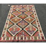 A Chobi Kilim with a large all over multicoloured stepped diamond pattern 187 x 126cm approx.