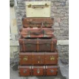 Five pieces of vintage luggage including a vintage velum case